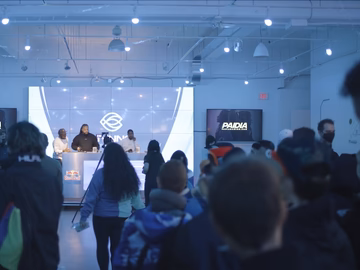 Attendees gathering at a Paidia Mixer Series IRL event